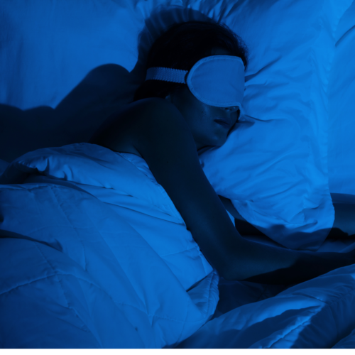 Someone sleeping with a sleep mask